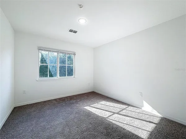 an empty room with a empty space and window