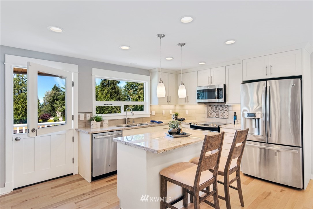 3617 Geyer Lane Everett, WA 98203 - Photo 4 of 23 a kitchen with appliances a sink and cabinets
