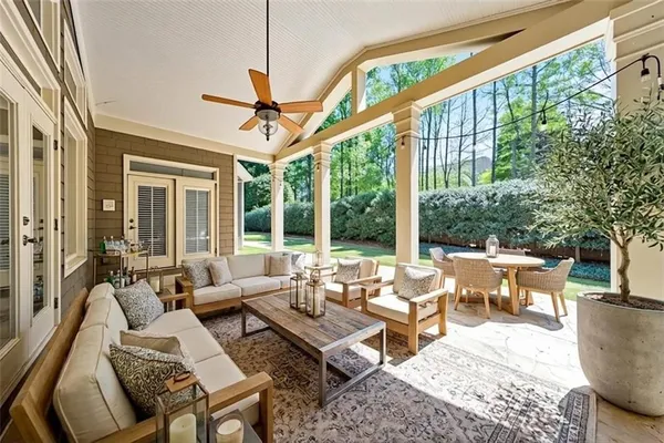 an aerial view of house with yard swimming pool and outdoor seating