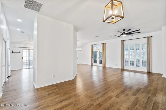 a kitchen with cabinets stainless steel appliances and a sink