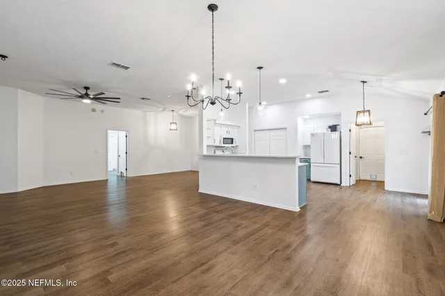 a backyard of a house with large trees