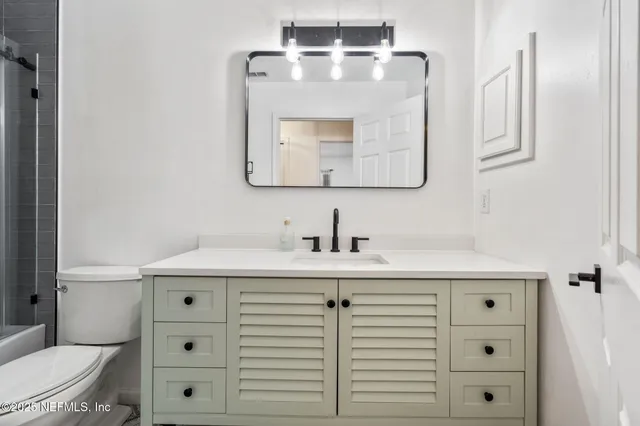 a living room with furniture or couches and a large window