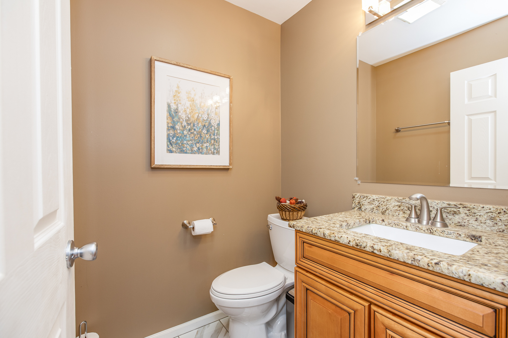 718 Huntington Drive Carol Stream, IL 60188 - Photo 11 of 28 a bathroom with a granite countertop toilet a sink and a mirror