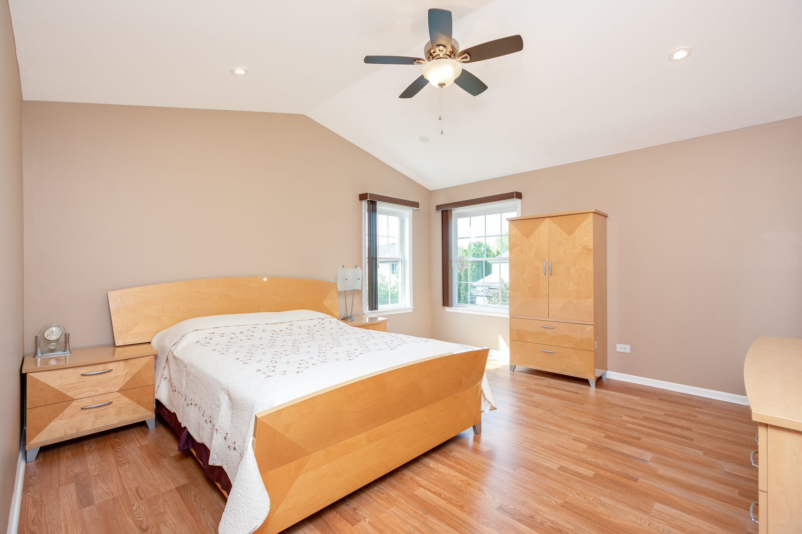 718 Huntington Drive Carol Stream, IL 60188 - Photo 12 of 28 a spacious bedroom with a bed and wooden floor