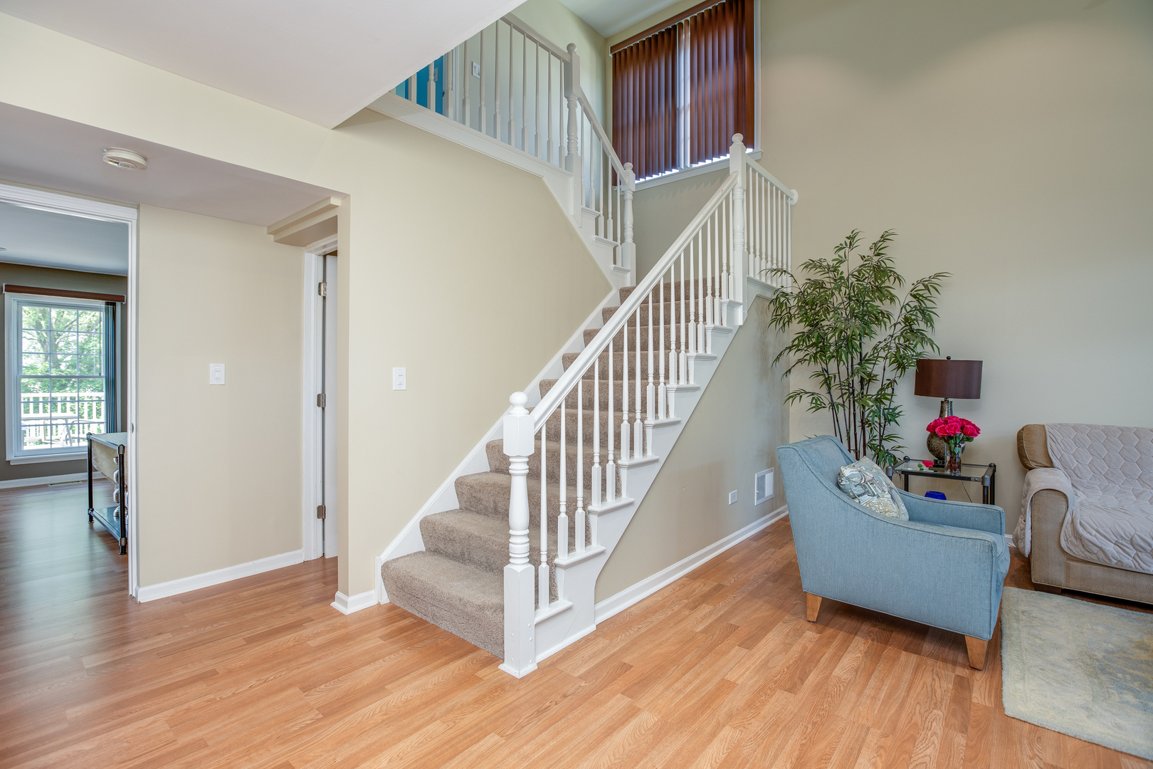 718 Huntington Drive Carol Stream, IL 60188 - Photo 2 of 28 a view of entryway and hall with wooden floor