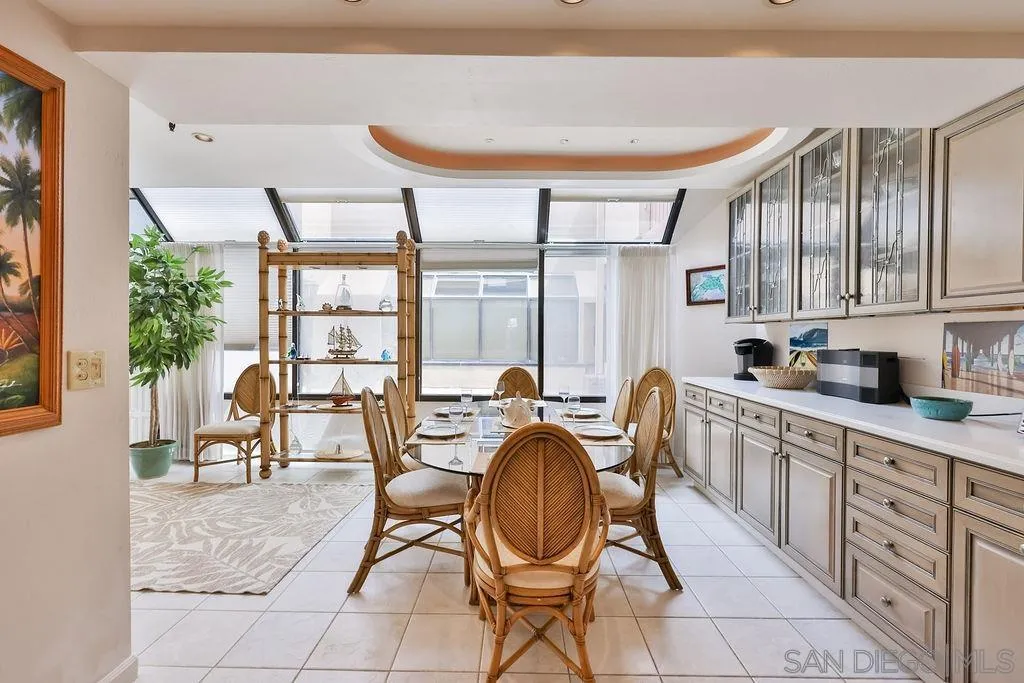 835 D Avenue, Unit 4 Coronado, CA 92118 - Photo 12 of 35 a kitchen with sink a table and chairs in it
