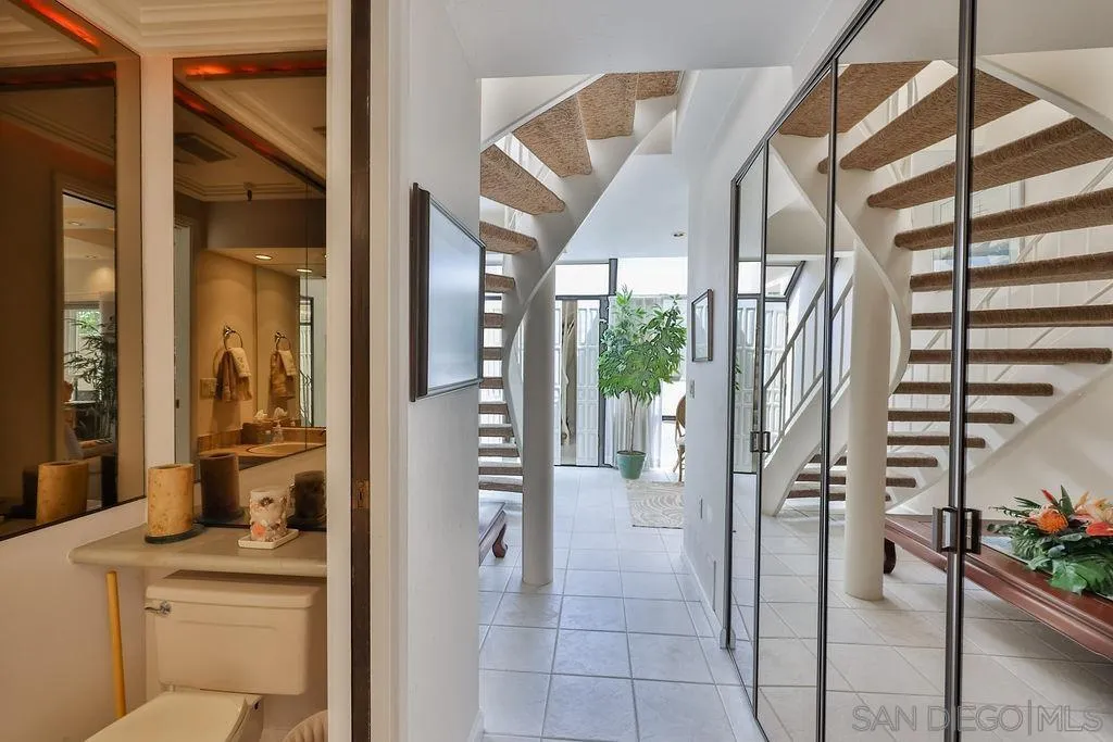 835 D Avenue, Unit 4 Coronado, CA 92118 - Photo 16 of 35 a view of entryway and hall with wooden floor
