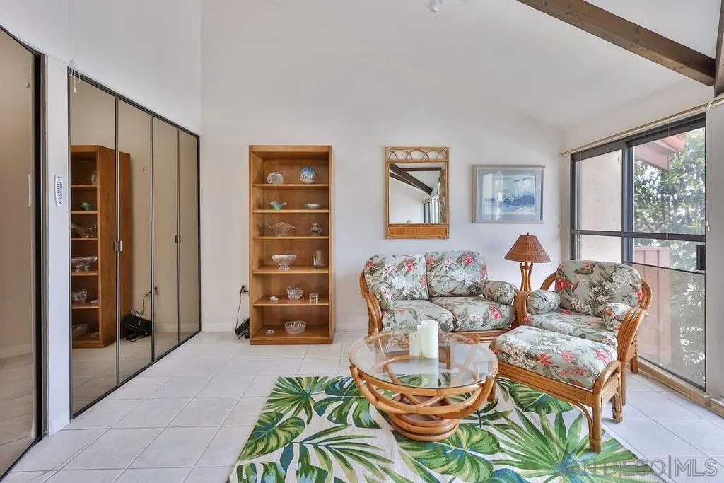 835 D Avenue, Unit 4 Coronado, CA 92118 - Photo 27 of 35 a living room with furniture and a flat screen tv