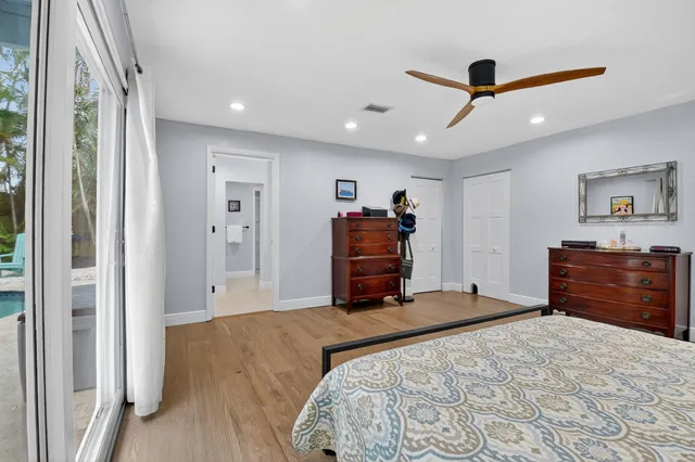 a bathroom with a sink vanity and mirror