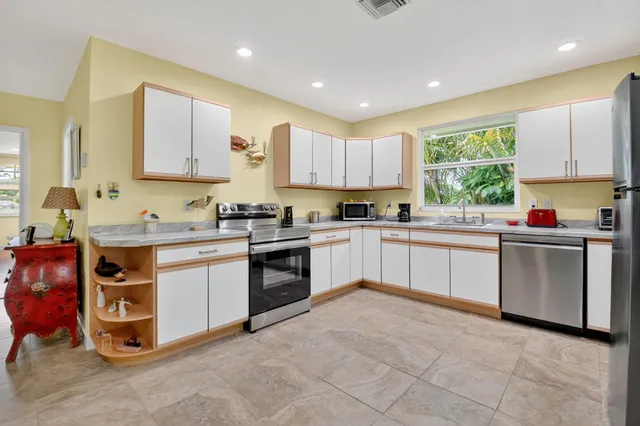 a bedroom with a bed couch and window