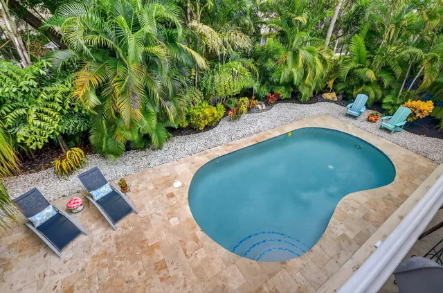 a view of a hallway with potted plants