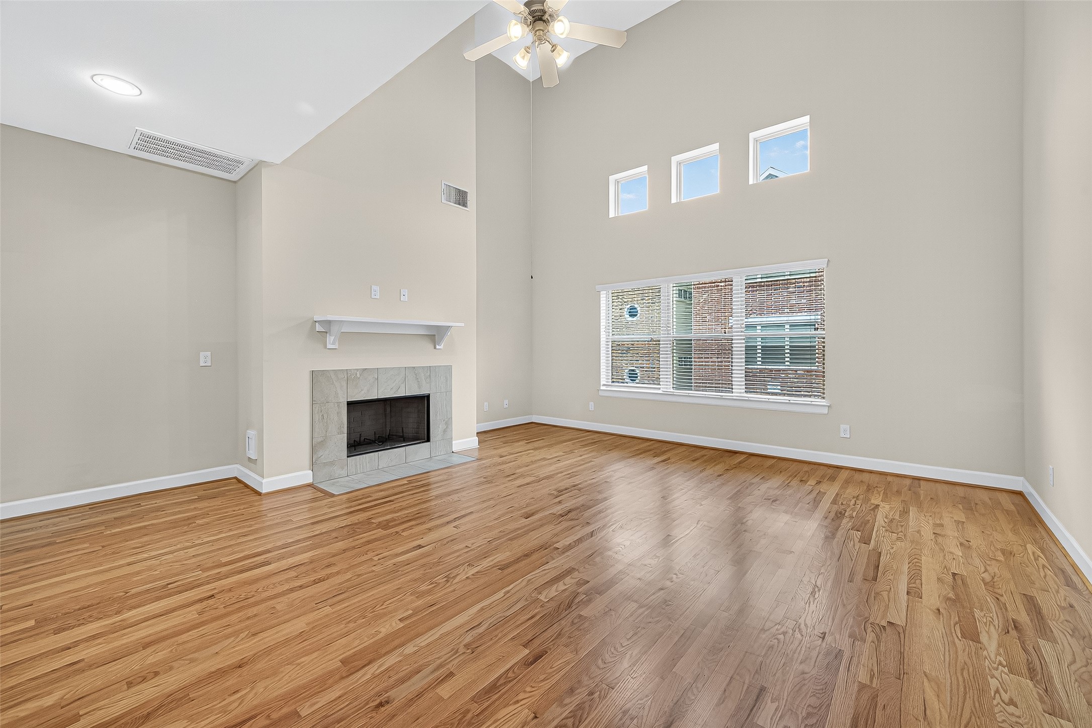 11510 Main Ash Drive Houston, TX 77025 - Photo 11 of 39 a view of an empty room with wooden floor and a window