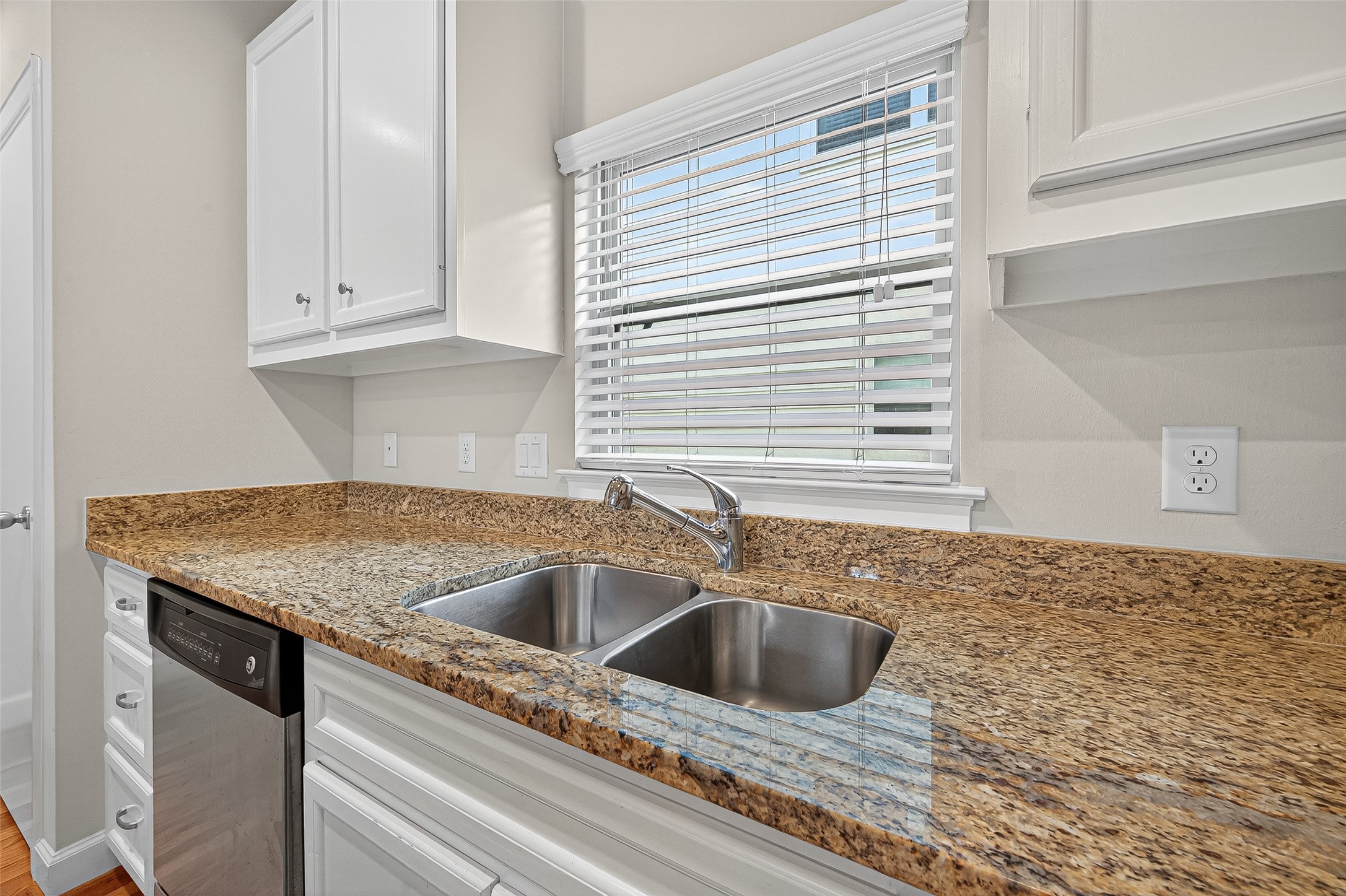 11510 Main Ash Drive Houston, TX 77025 - Photo 18 of 39 a kitchen with granite countertop a sink and a window