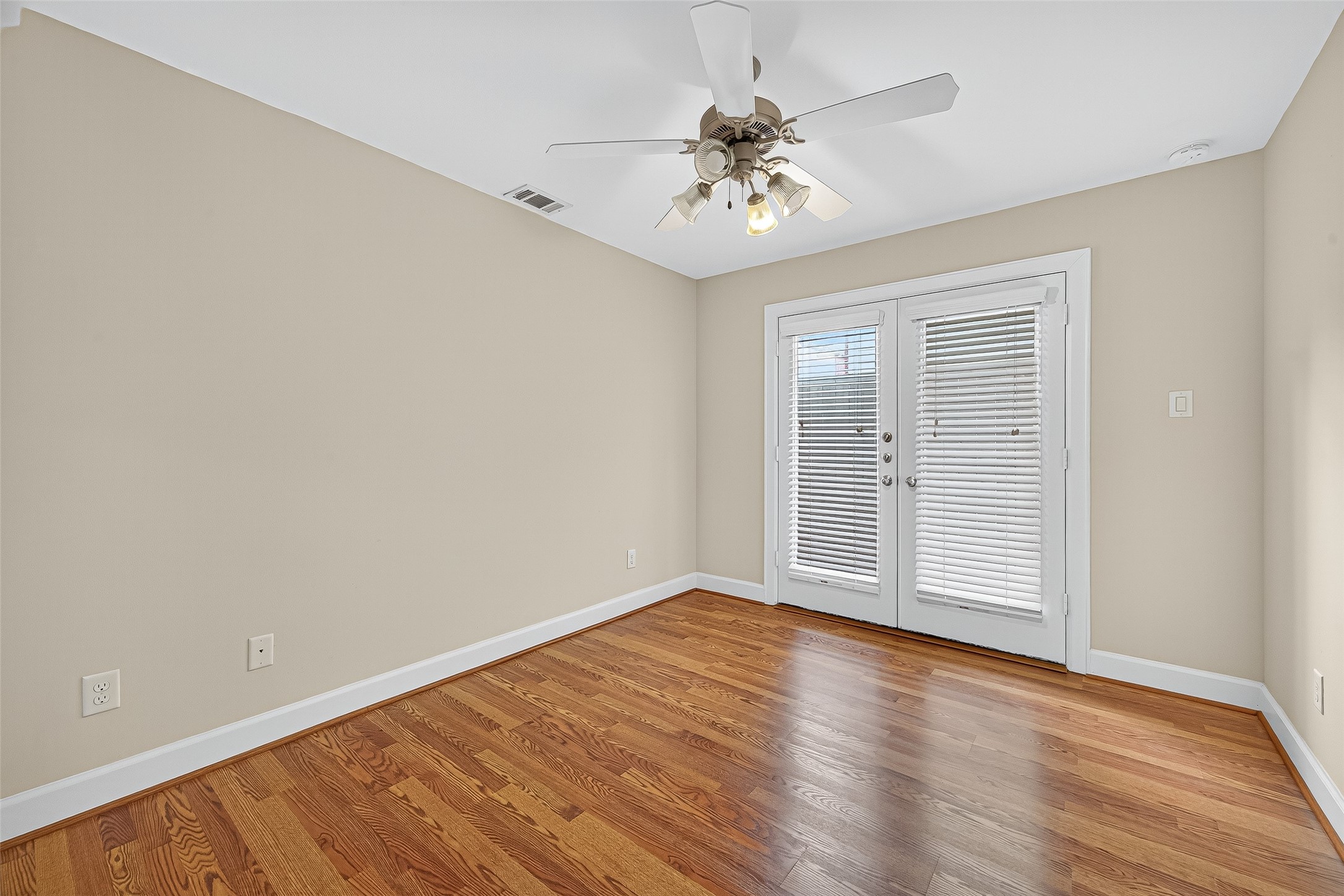 11510 Main Ash Drive Houston, TX 77025 - Photo 25 of 39 a view of an empty room with wooden floor and a window