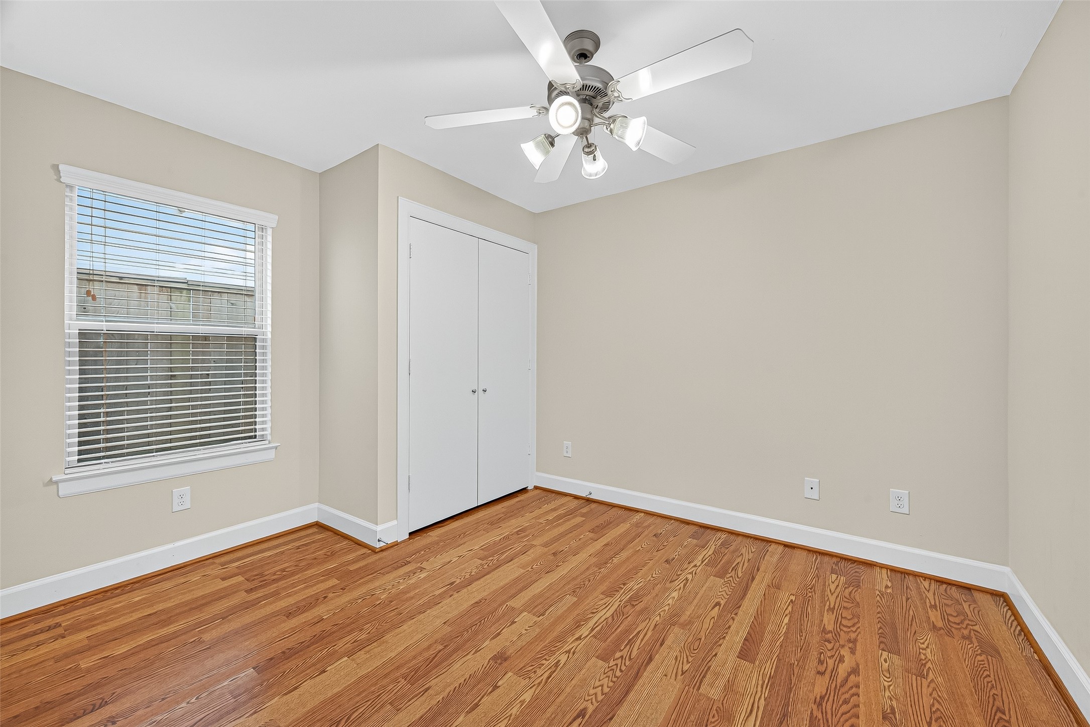 11510 Main Ash Drive Houston, TX 77025 - Photo 27 of 39 a view of an empty room with wooden floor and a window