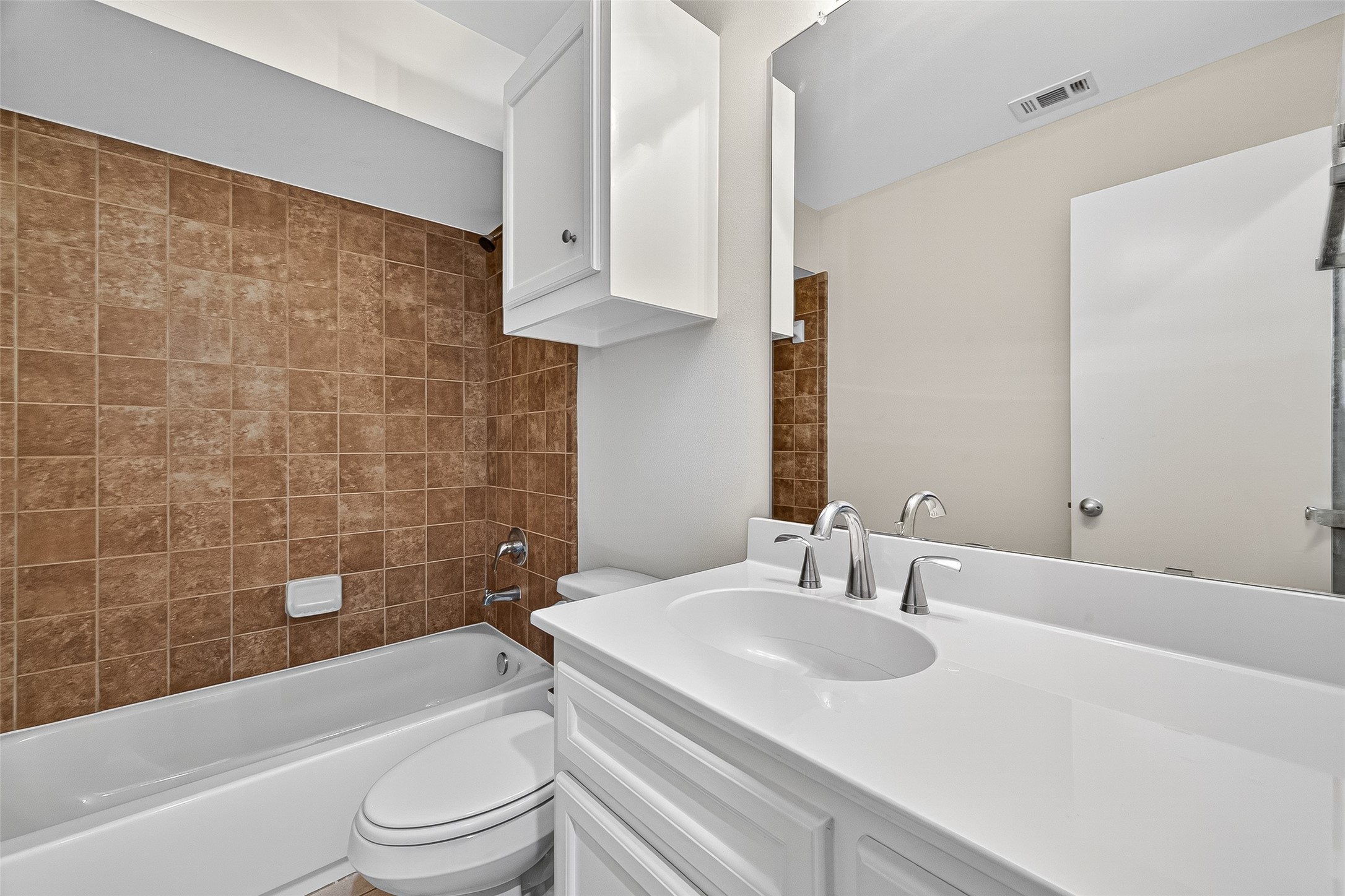 11510 Main Ash Drive Houston, TX 77025 - Photo 28 of 39 a bathroom with a granite countertop bathtub sink vanity mirror and toilet