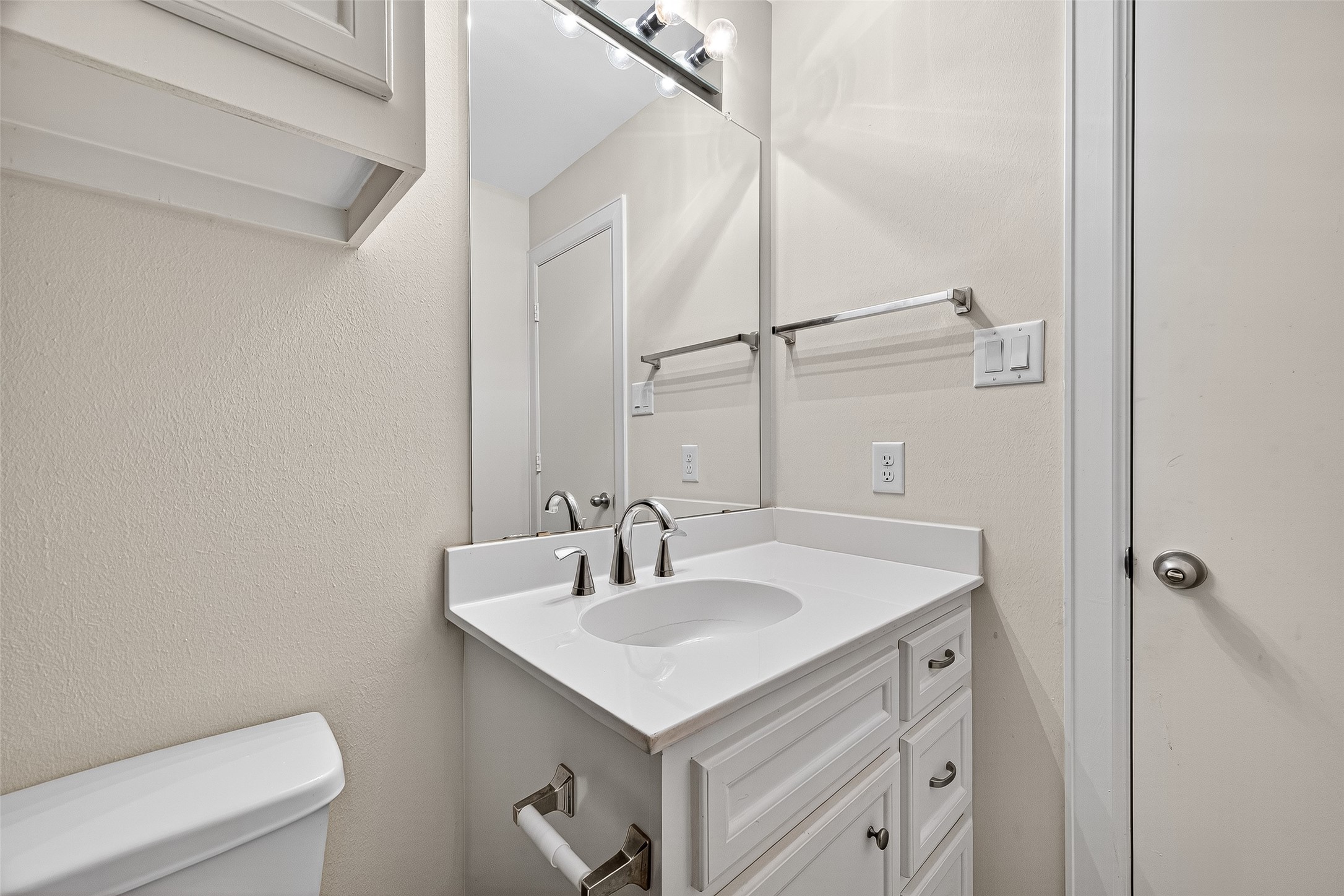 11510 Main Ash Drive Houston, TX 77025 - Photo 29 of 39 a bathroom with a sink toilet and vanity