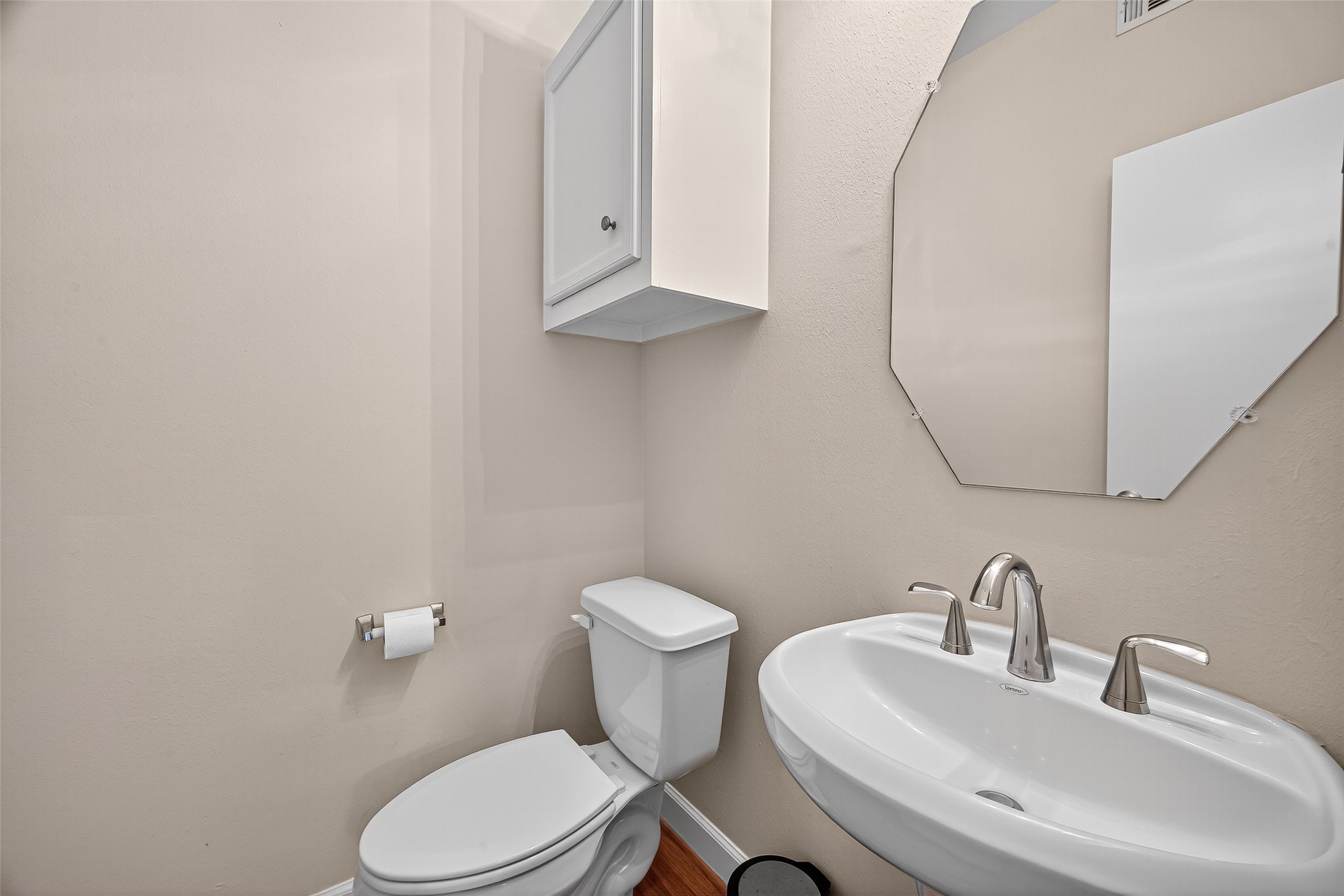 11510 Main Ash Drive Houston, TX 77025 - Photo 30 of 39 a white toilet sitting next to a bathroom sink