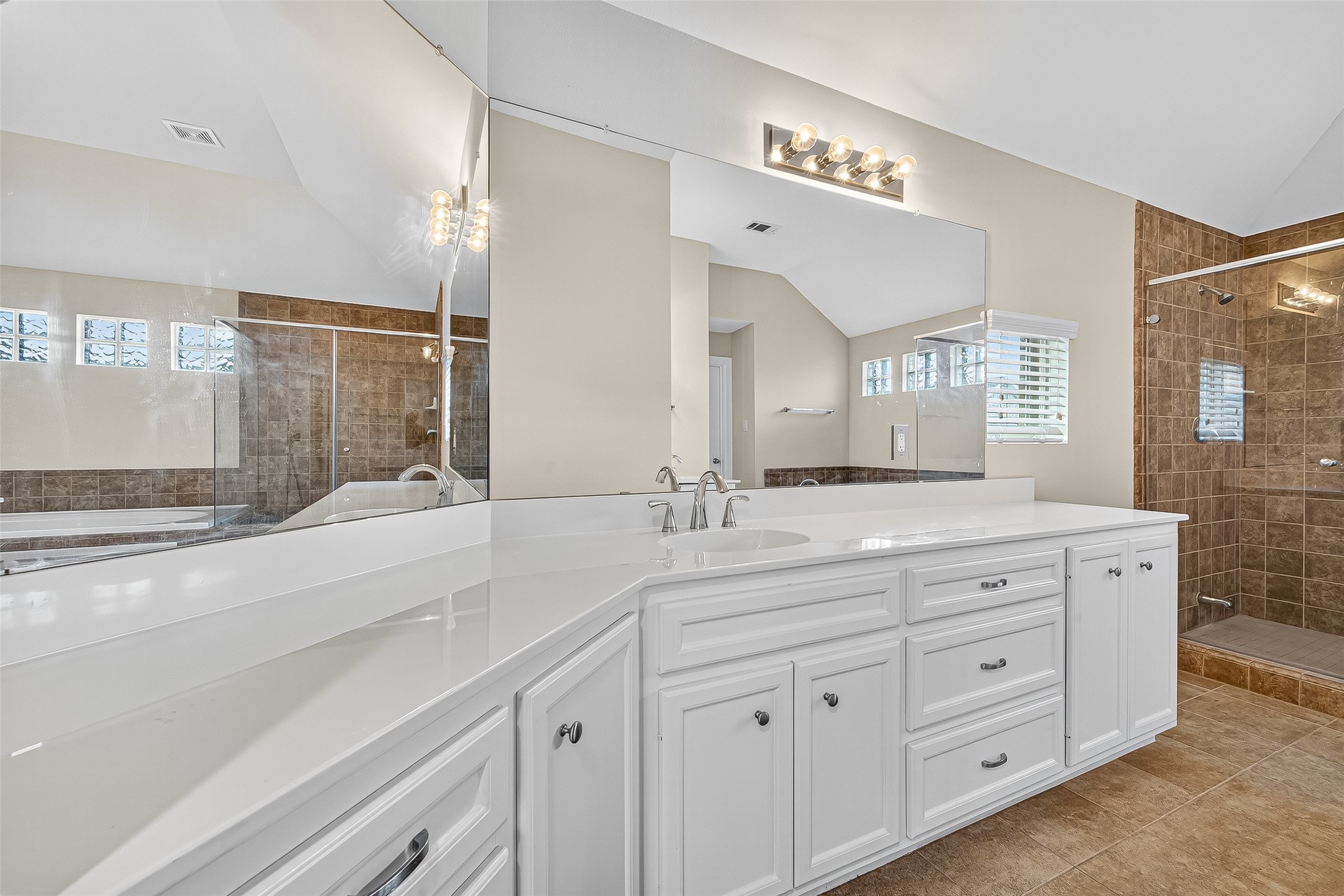 11510 Main Ash Drive Houston, TX 77025 - Photo 34 of 39 a spacious bathroom with double sink and a large mirror