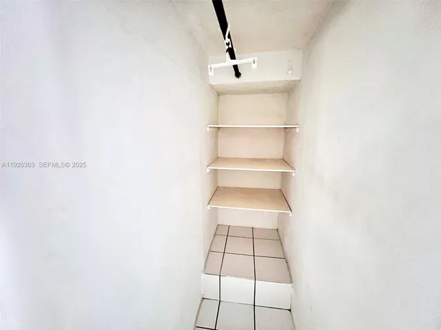 a view of a room with rack on the wall