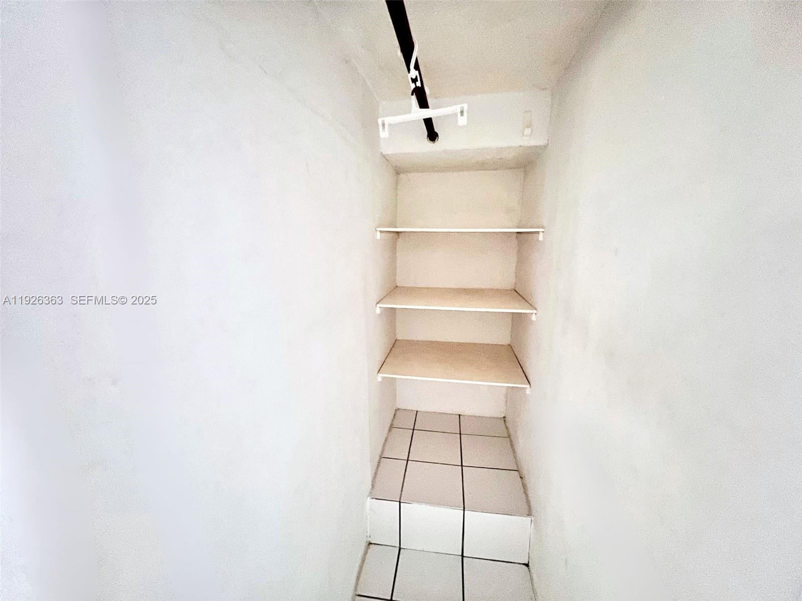 227 Phoenetia Avenue, Unit 3 Coral Gables, FL 33134 - Photo 9 of 10 a view of a room with rack on the wall