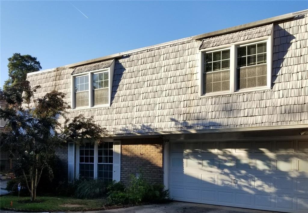 Large townhome just 3 blocks from the Decatur Square has over 1800 square feet on just two levels - not vertical like so many newer townhomes. Plus your very own 2-car garage!