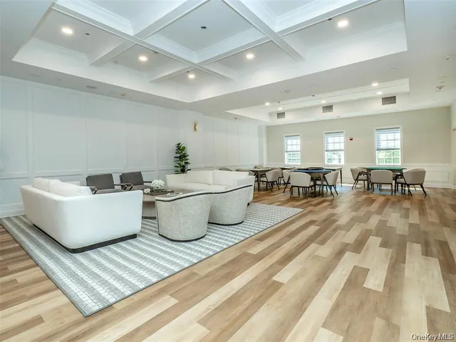 a living room with lots of furniture and a rug
