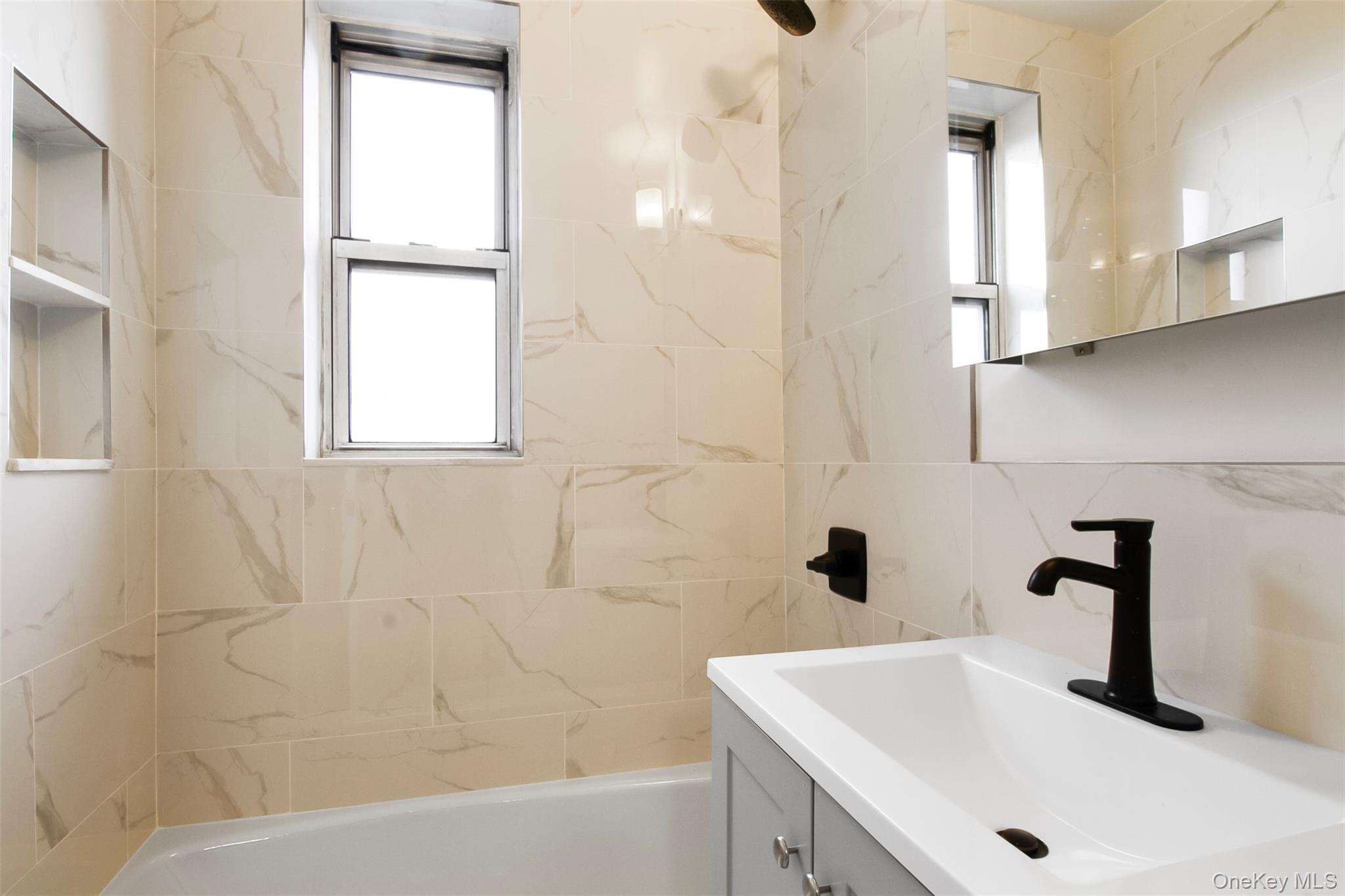 485 Bronx River Road, Unit A50 Yonkers, NY 10704 - Photo 16 of 23 a bathroom with a sink and a bathtub