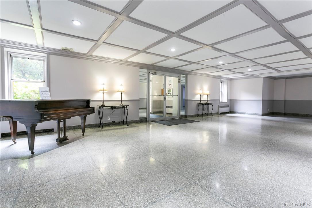 485 Bronx River Road, Unit A50 Yonkers, NY 10704 - Photo 2 of 23 a area with lots of furniture and a chandelier