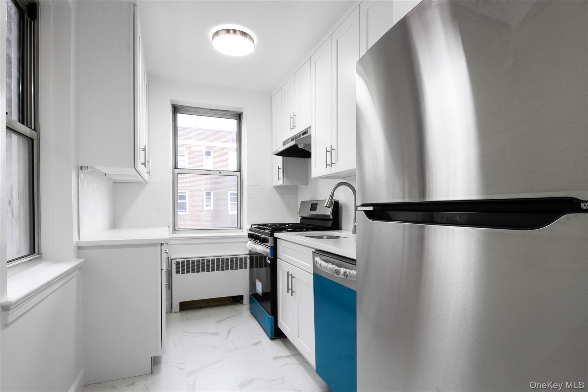 485 Bronx River Road, Unit A50 Yonkers, NY 10704 - Photo 9 of 23 a kitchen with a stove and a refrigerator
