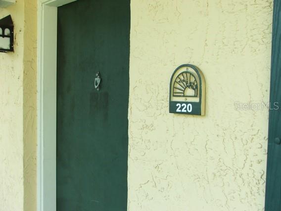 a wall with a sign on it and a door