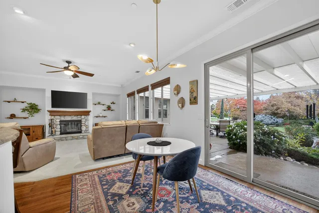 a spacious bathroom with a sink double vanity granite and a shower