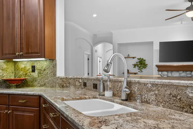 a bathroom with a sink double vanity granite tub and shower