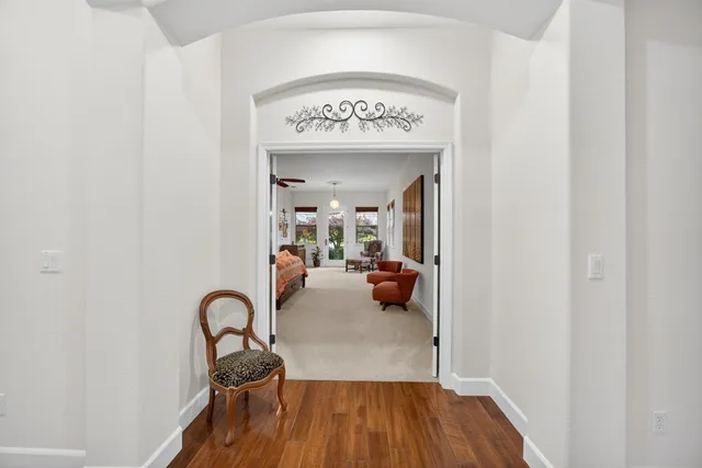 a view of a patio with table and chairs and potted plants