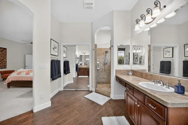 a view of a house with a yard and a garage