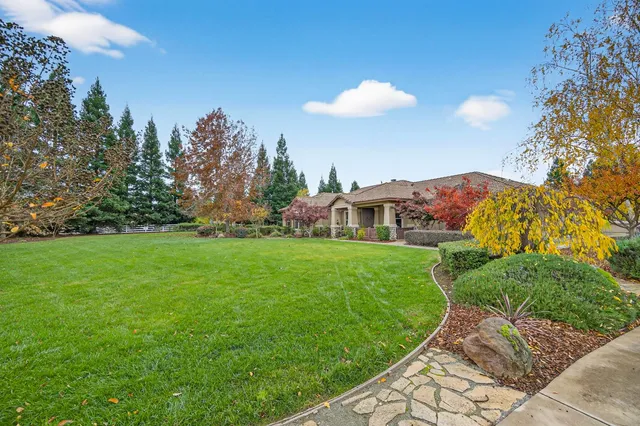 a view of kitchen with furniture and chandelier