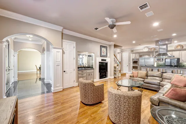 a living room with furniture and kitchen view