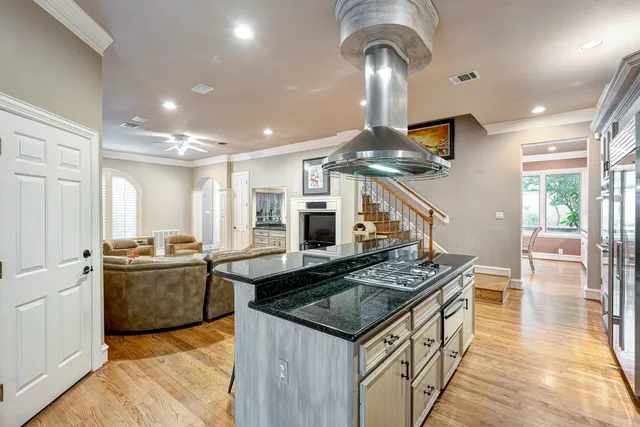 a kitchen with stainless steel appliances granite countertop a stove and a sink