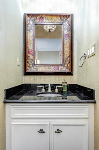 a close view of a stove sink and mirror