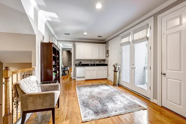 a kitchen with stainless steel appliances granite countertop a refrigerator and microwave