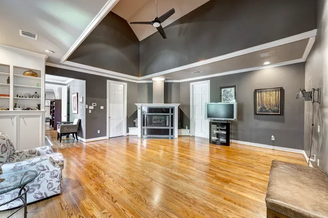 a swimming pool with table and chairs