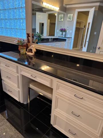 a view of living room with granite countertop cabinets