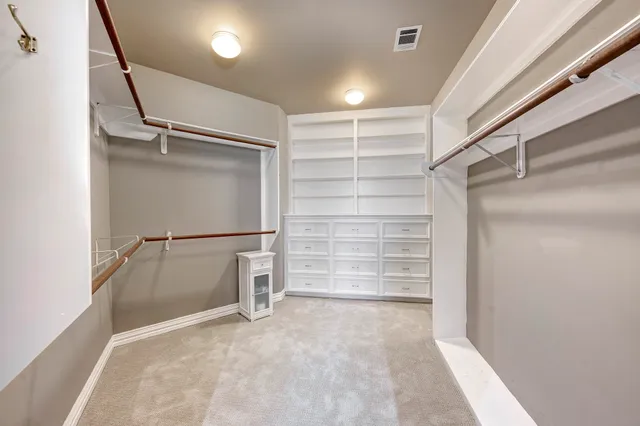 a view of an empty walk in closet