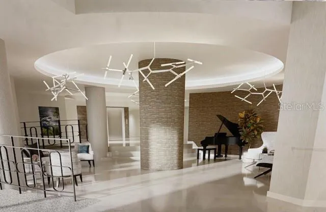 a view of a livingroom with furniture and staircase