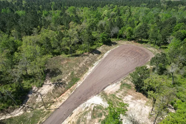 a view of a street with a yard