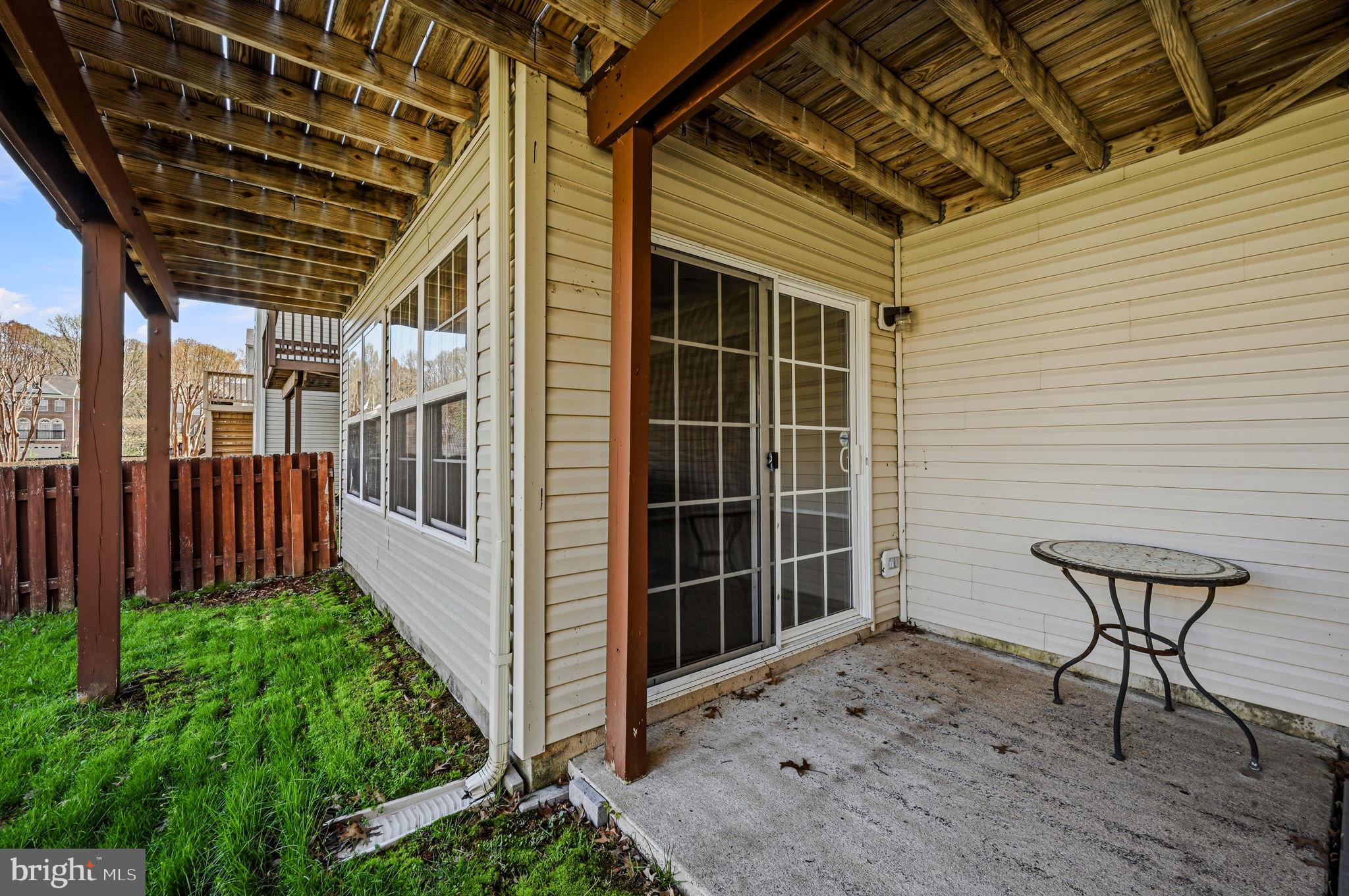 13 Laurel Way Bear, DE 19701 - Photo 42 of 44 a view of a porch with furniture and floor to ceiling window