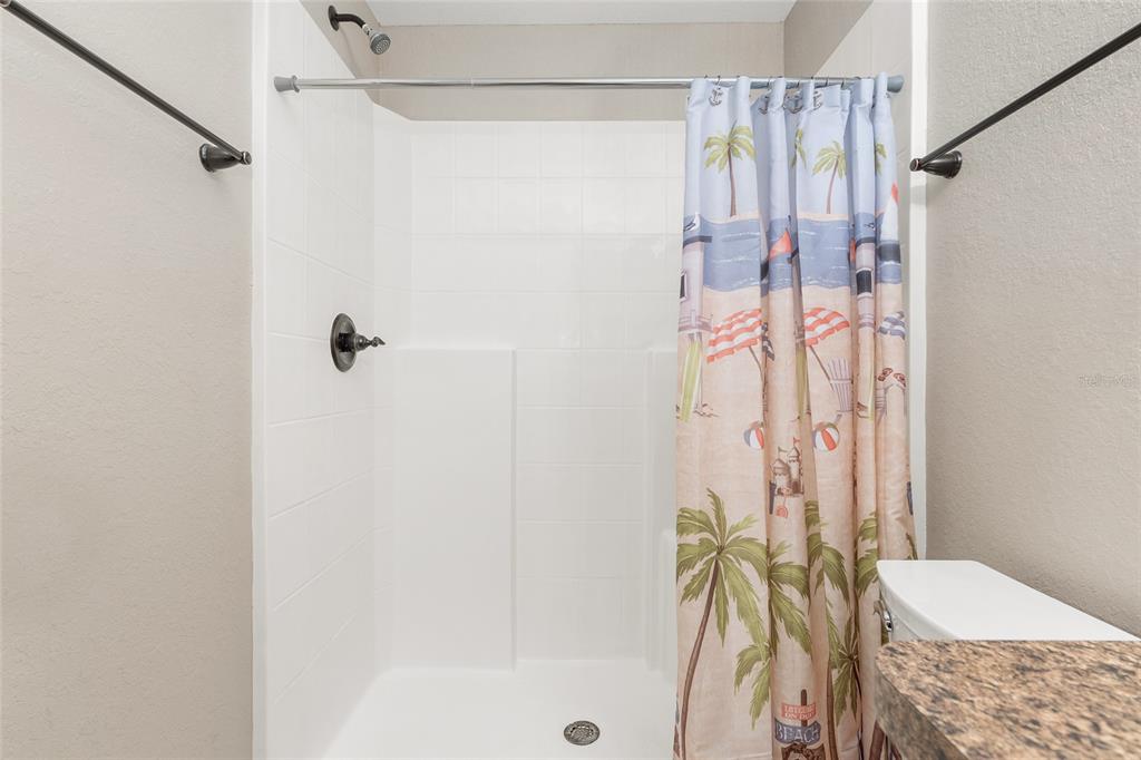2 Hemlock Loop Drive Ocala, FL 34472 - Photo 18 of 28 a bathroom with a shower curtain and a window