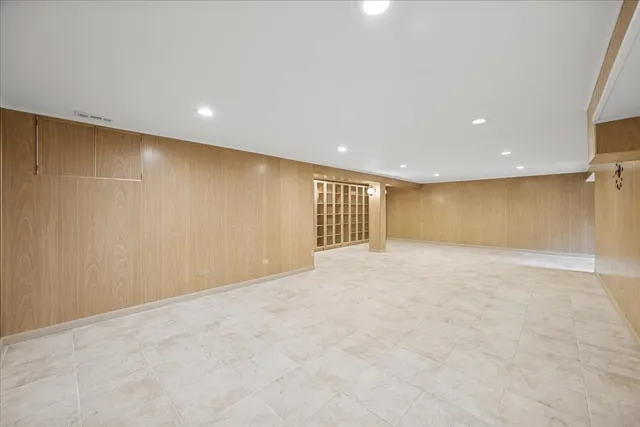 a view of a backyard with furniture and a garden