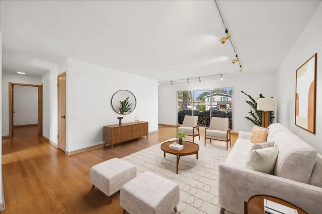 a view of a livingroom with wooden floor