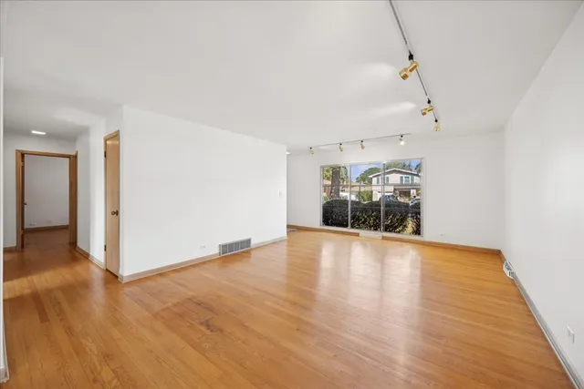 a living room with furniture a rug and a window